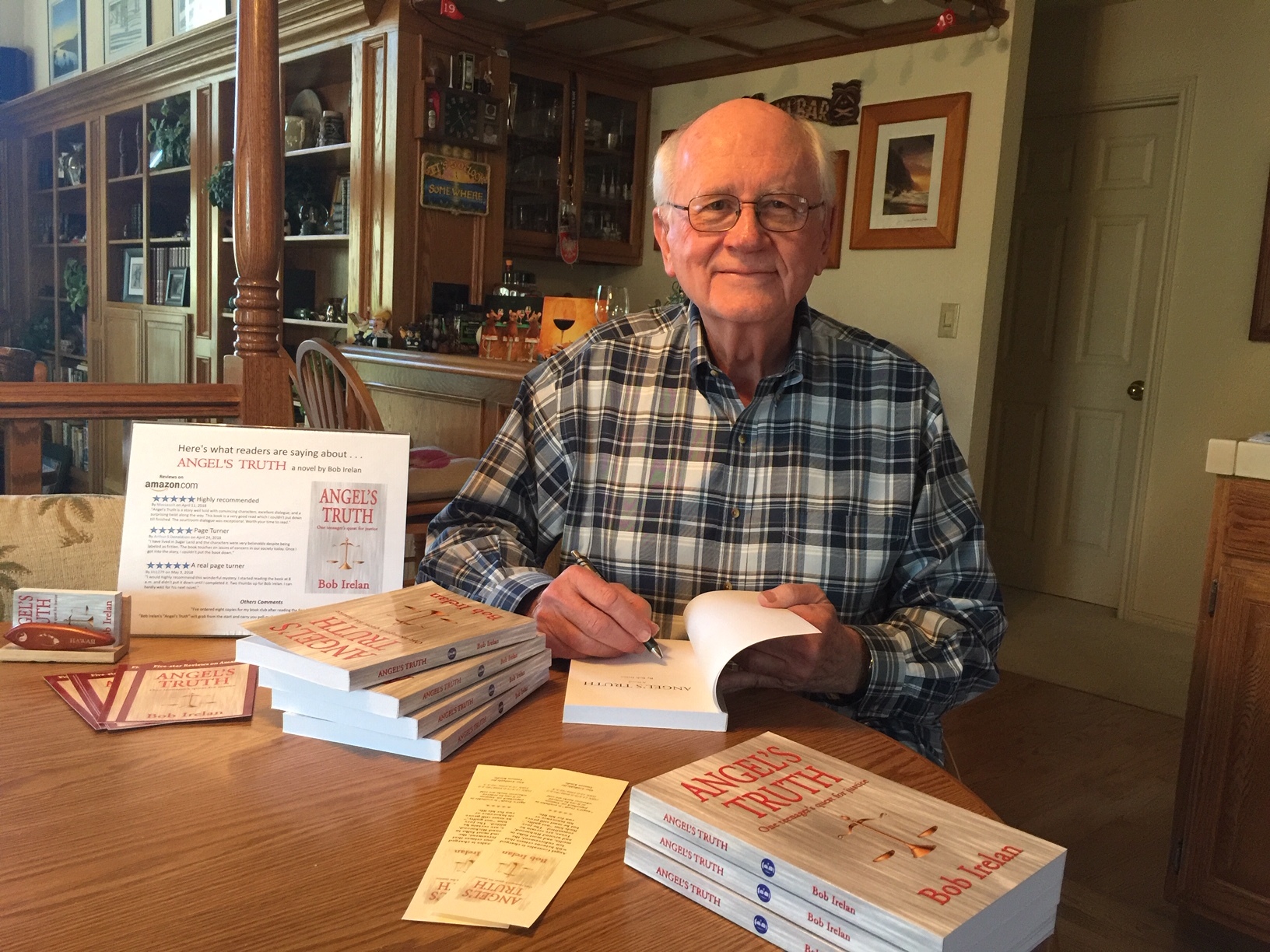 Author Bob Irelan with his first novel, Angel's Truth